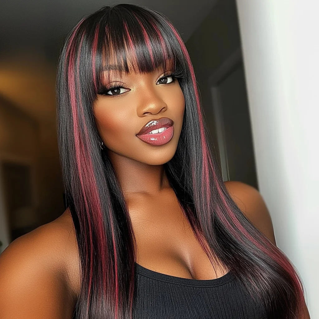 Model wearing a long black straight wig with red highlights, full bangs and softly curved ends.