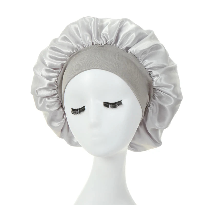 a silver silk bonnet on a mannequin 