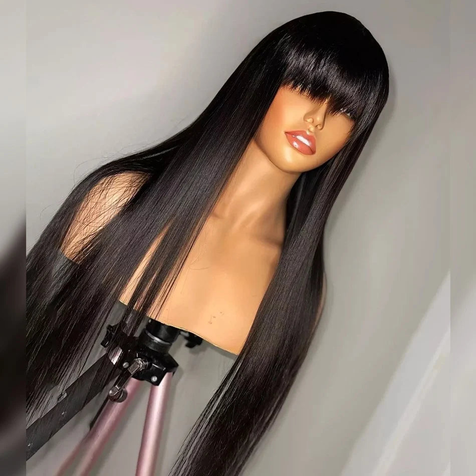 Angled view of a long black straight wig on a mannequin, showing full blunt bangs and sleek, tapered strands.