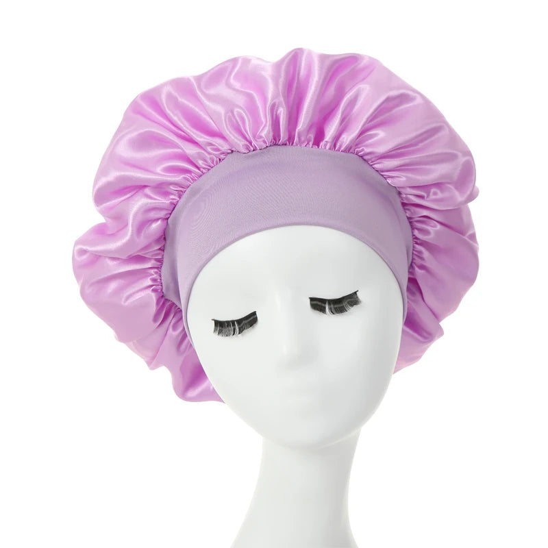 a pink silk bonnet on a mannequin 