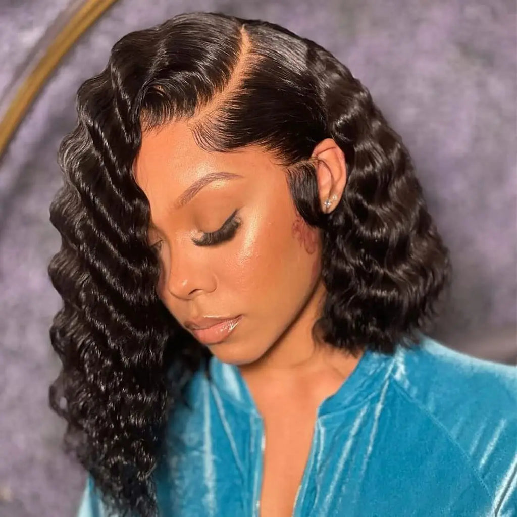 Model wearing a black deep wave bob with a curved side part, glossy defined waves and styled baby hairs.