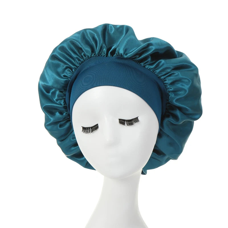 a teal silk bonnet on a mannequin 