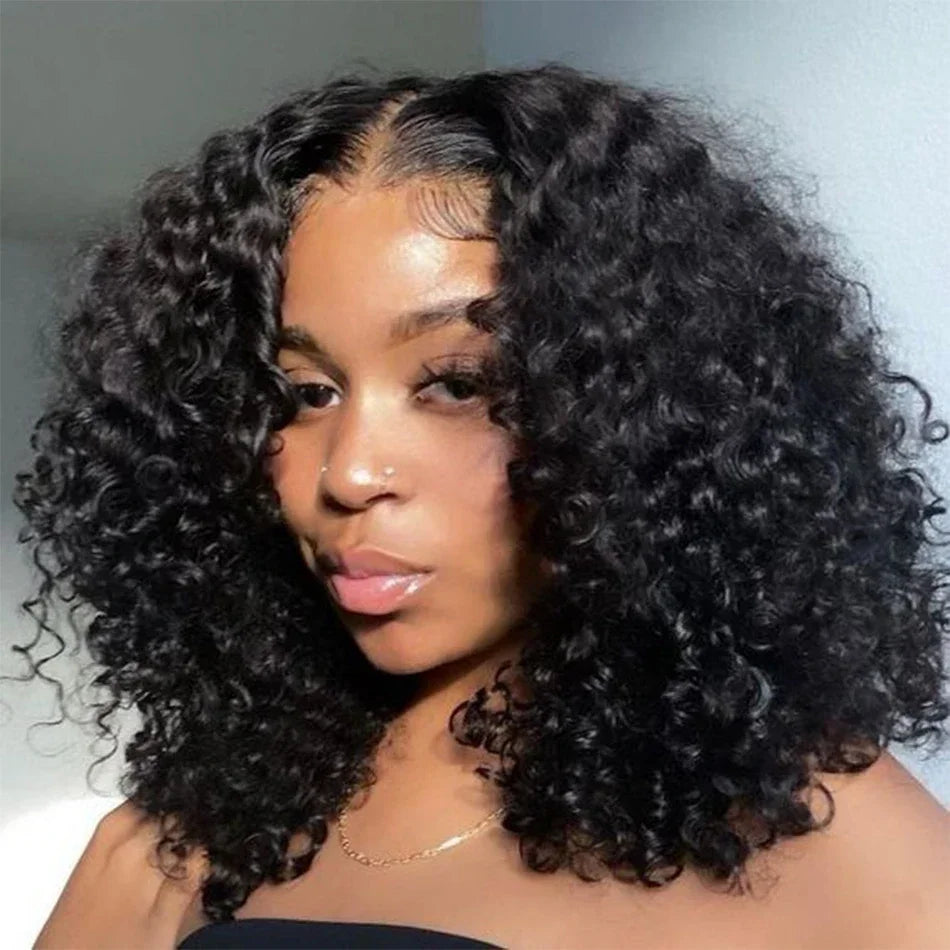 Model wearing a voluminous black deep wave bob with a center part, defined curls and styled baby hairs.